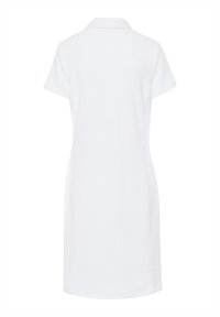 Witte polo jurk met korte mouwen van een gestructureerde stof, met kraag en een rechte snit, met een detail van een achternaad. De lengte valt boven de knie.
