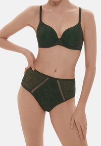 Green lace bra and high-waisted brief set, featuring floral patterns, padded cups, narrow straps, and mesh detailing on the sides.
