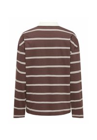 Pikkade varrukatega polo särg pruunis värvitoonis, valgete horisontaalsete triipudega, valge krae ja pehme puuvillane materjal. Klassikaline lõige, mingeid silmapaistvaid detaile ei ole.