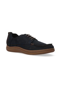 Marineblaue Wildlederschuhe mit brauner Gummisohle. Besondere Merkmale sind die genähten Details und das Schnürdesign. Leicht spitz zulaufende Zehenpartie mit strukturierter Oberfläche.