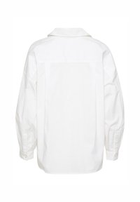 White cotton shirt, long sleeves with buttoned cuffs, a classic collar, and a loose fit, featuring a clean, smooth texture on the back.