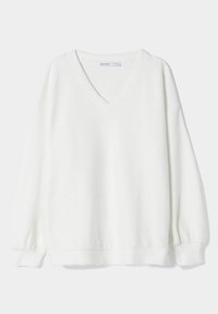 Felpa bianca a V in morbido tessuto, con maniche lunghe e polsini elasticizzati, dal fit rilassato. Design semplice e pulito.