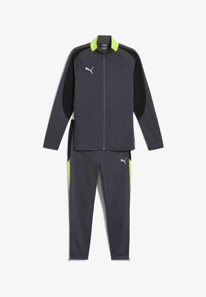 Tepláková souprava v tmavě šedé barvě s černými a limetkově zelenými akcenty. Obsahuje zipovou bundu a odpovídající kalhoty, vyrobené z hladkého, lehkého materiálu.