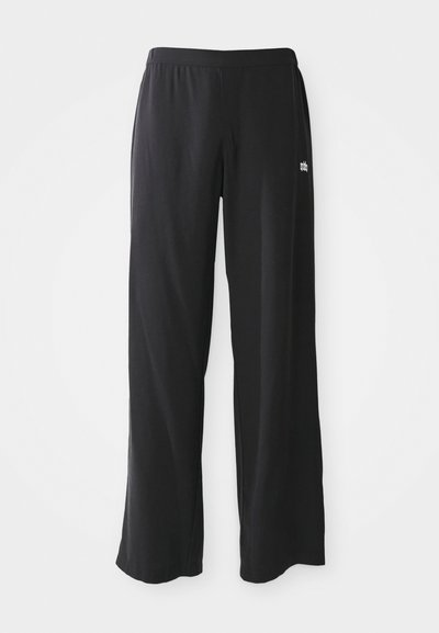 Svart, vida loungebyxor med elastisk midja och mjuk textur. Har en liten broderad logotyp på framsidan.
