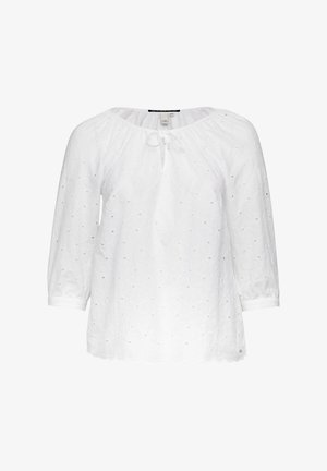 Biała bluzka z rękawami o długości trzech ćwiartek, okrągłym dekoltem, z detalem ze sznurkiem oraz haftowanym wzorem kwiatowym na całej powierzchni. Gładka faktura.