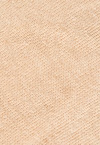 Helles beige gewebtes Material mit einer glatten Textur, einem subtilen diagonalen Muster und gleichmäßigen Stichen überall.