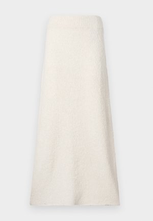 Knelang krem håndkle skjørt laget av teksturert stoff, med en ribbet midjebånd og en løs, flytende design.