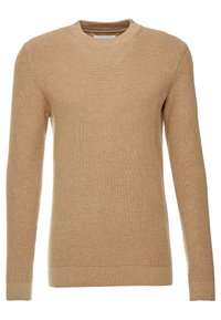 Pull long à manches longues en tricot beige à côtes avec un col rond. Texture douce, silhouette ajustée et poignets et taille côtelés.