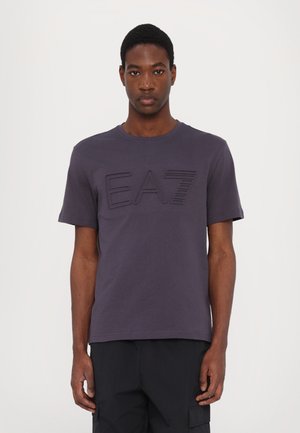 Navy cotton t-shirt with short sleeves and a crew neckline, featuring a textured EA7 logo across the front. Smooth fabric, classic fit.