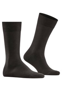 Schwarze Baumwollsocken mit einer glatten Textur, gerippten Bündchen und einer klassischen Knöchellänge. Entworfen für Komfort und Haltbarkeit.