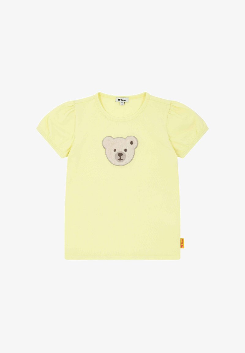 Žluté tričko s krátkým rukávem, kulatým výstřihem a nabranými rukávy, se středovým aplikovaným motivem medvědí tváře v šedé a béžové barvě.