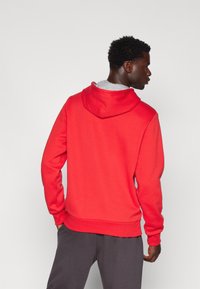 Champion GRAPHIC HOODIE - Džemperis ar kapuci - red