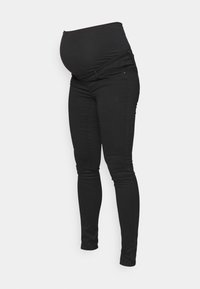 Jeans de maternidad negros con una cintura elástica que se coloca sobre el vientre, ajuste slim y suave textura de denim. Diseñados para brindar comodidad y soporte.
