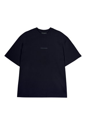 T-shirt en coton noir à manches courtes, col rond, avec un logo minimaliste "PEGADOR" dans une teinte plus claire centré sur la poitrine.