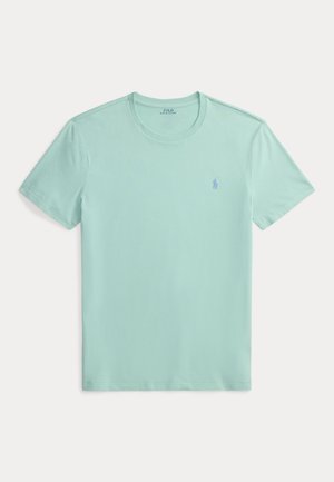 Camiseta de manga corta en verde menta claro de algodón suave, con escote redondeado y un pequeño logo del mismo color en el pecho.