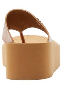 Brown platform flip-flops with a cork insole, featuring a wide strap and a textured, tan outer sole. Simple design with minimal hardware accents.