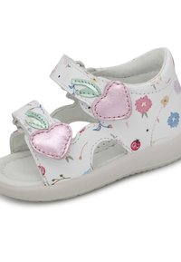 Witte leren sandalen met bloemmotieven, twee verstelbare bandjes en roze hartaccenten. Lichtgewicht zool met uitsparingen aan de zijkanten voor ademend vermogen.