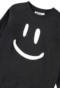 Felpa nera in cotone, con un grande sorriso ricamato bianco sul davanti. Collo rotondo e maniche raglan.