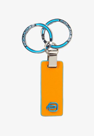 Keychain featuring two silver rings with blue accents, attached to an orange rectangular tag with a blue logo and smooth texture.