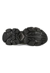 Zwarte rubberen schoenzool met een textuurpatroon en diepe groeven voor grip, met een verstevigd midden en een onderscheidend profielontwerp.