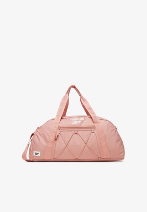 Bolsa de deporte rosa de Reebok con dos asas, bolsillo delantero con cremallera, detalles de cordón elástico y parches con el logo en la bolsa y las correas.