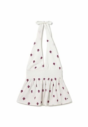 Witte haltertop met een gerimpelde taille en kleine paarse bloemenprints verspreid over de stof.