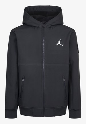 Zwarte hooded jacket met een rits aan de voorkant, zijzakken en een wit Jordan-logo op de borst. Gemaakt van een soepele, flexibele stof.
