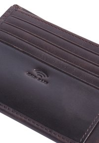 Brown leather cardholder with multiple card slots, smooth texture, and subtle branding embossed on the surface.