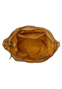 Tan leren tas met een beige interieur, voorzien van een ritssluiting, een ruime hoofdcompartiment en een enkel vak voor organisatie.