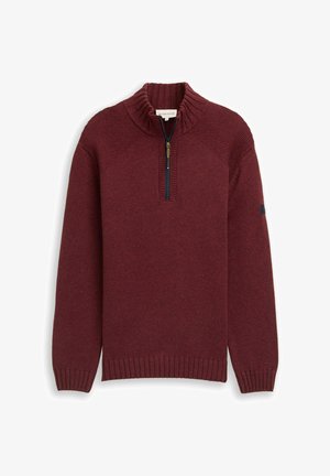 Bordeauxrode gebreide trui met een hoge kraag en een halve ritssluiting. Voorzien van geribbelde manchetten en zoom, en getextureerde schouderaccenten. Glad stofafwerking.