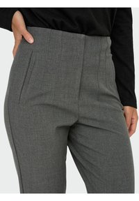 Gray tailored trousers with a textured finish, featuring side pockets and vertical seam details for a structured fit.