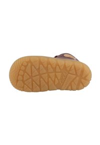 Sole in gomma con un motivo di battistrada testurizzato e multidirezionale. Colore marrone con un logo chiaro e dettagli di branding sul lato.