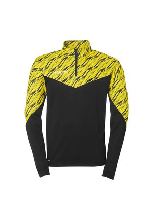 Langærmet sportshems med et lyst gult geometrisk mønster på toppen, en sort krop og en halv-zip krave for ventilation.