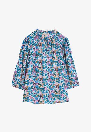 Bloem blouse met lange mouwen, ronde halslijn, met een multicolore patroon van blauwe, roze en groene bloemen op een lichte achtergrond.