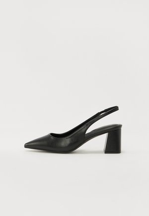 Black leather slingback heels with a pointed toe and a block heel. Features a cutout design and smooth texture, minimalistic and modern.