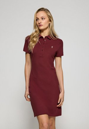 Burgundy polo dress made of soft cotton, featuring a collar, short sleeves, six-button placket, and small embroidered logo on the chest.