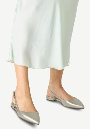 Pointed-toe slingback flats in metallic silver, featuring a sleek design, low block heel, and adjustable strap for a secure fit.