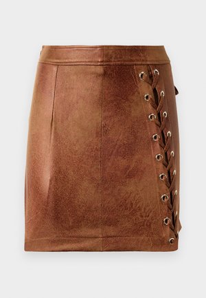 Brown faux leather mini skirt with a fitted shape, featuring side lacing and metal eyelets for added detail and texture.