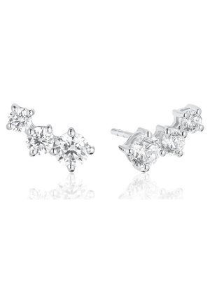 Boucles d'oreilles en argent avec trois pierres précieuses rondes transparentes chacune, disposées en ligne courbe, présentées sur fond blanc.