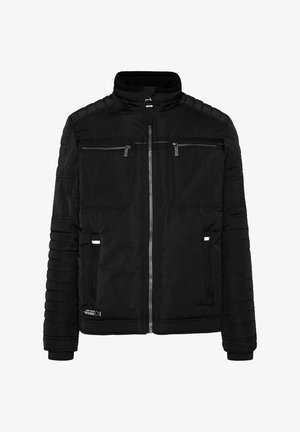 Black jacket with a zip front, two chest pockets, and ribbed cuffs. Features padded shoulders and texture variations on sleeves.