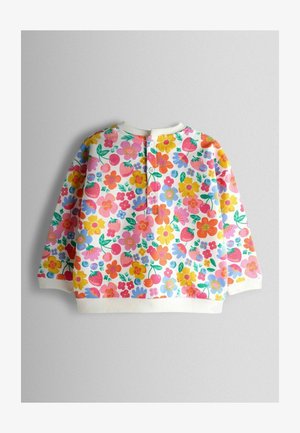 Heledas roosas toonis lillemustriga dressipluus, millel on mitmevärvilised lilled ja maasikad. Valge soonikkoes kaelus ja varrukate äärised. Kolme nupuga esiosa.