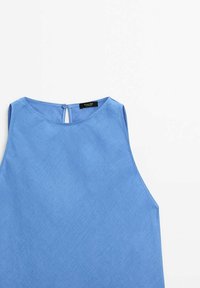 Blue sleeveless blouse with a textured fabric, round neckline, and a small back button closure. Clean design with a minimalist aesthetic.