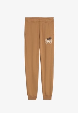 Prunadest joggerid elastse vööga, millel on valge graafika ja Puma logo vasakul puusal. Pehme kangatekstuur on nähtav.