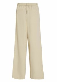 Beige wijde broek met een elastische tailleband, twee achterzakken en gladde stof, met een eenvoudig, minimalistischer ontwerp.
