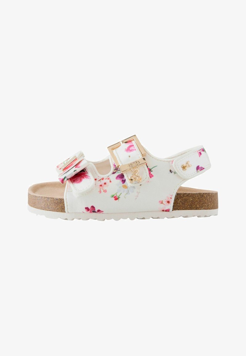 Sandale enfantine blanche à fleurs avec semelle en liège, brides réglables, boucle dorée et petit détail de charme.