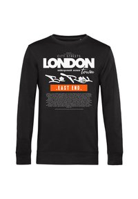 Sudore lungo nero con maniche, con testo bianco e arancione. Presenta stampe grafiche tra cui "LONDON" e "EAST END" in diversi caratteri.