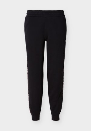 Svarte joggebukser med elastisk midjebånd og dyreprintstriper langs sidene, med mansjetter ved anklene.