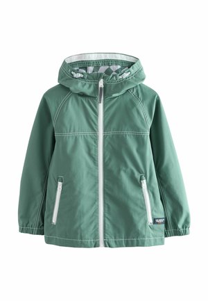 Grøn vandtæt jakke med hætte, hvid lynlås og to sidelommer. Har kontrastsyninger og elastiske manchetter. Glat tekstur.