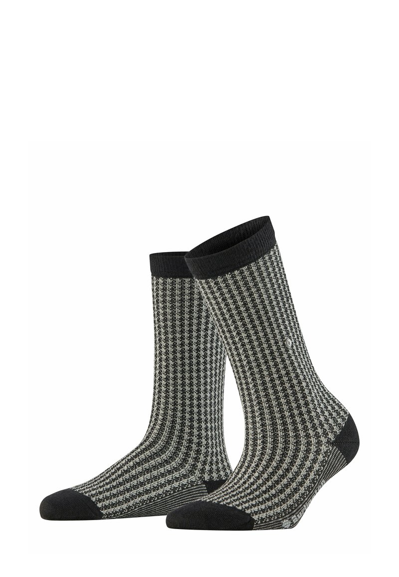 Schwarz-weiße gemusterte Socken mit gerippter Textur, featuring eine verstärkte dunkle Zehen- und Bündchenpartie, entworfen für Komfort und Langlebigkeit.