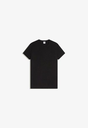 T-shirt noir à manches courtes avec col rond, posé à plat sur un fond blanc, vue de face avec une étiquette de marque visible à l'intérieur du col.